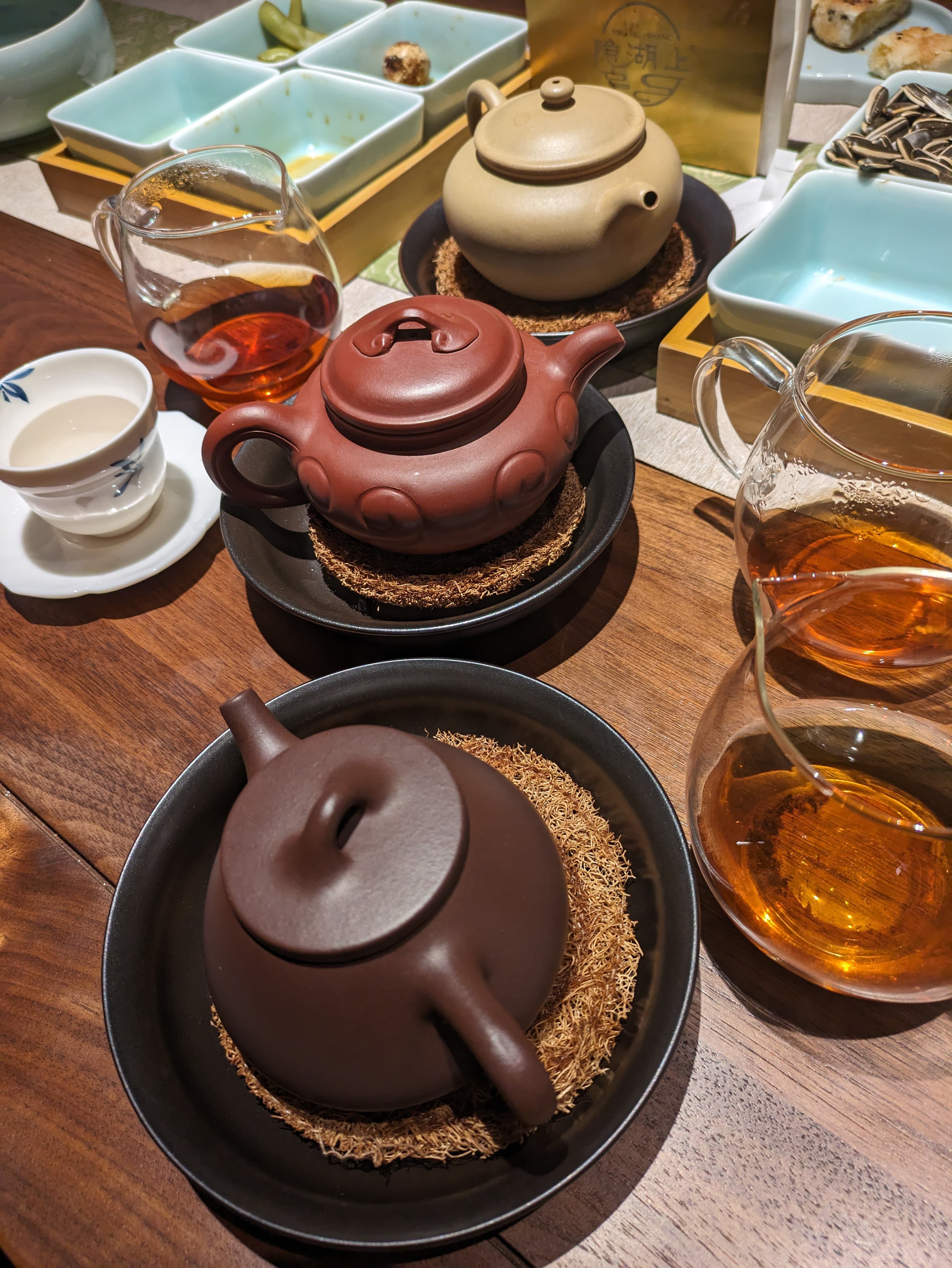 Yixing pots and fairness pitchers arranged for a gongfu session